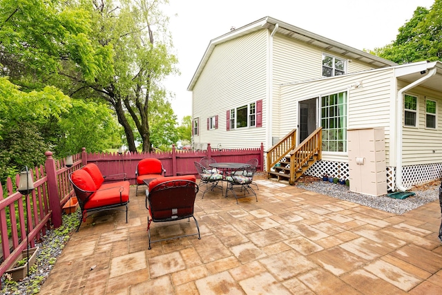 90 Fieldstone Blvd, Wappingers Falls, NY 12590 - fenced backyard with a patio area, entry steps, and outdoor dining area