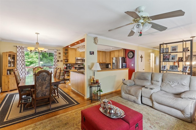 49 Sherwood Rd, Cortlandt Manor, NY 10567 - living room with a chandelier, crown molding, wood finished floors, and ceiling fan
