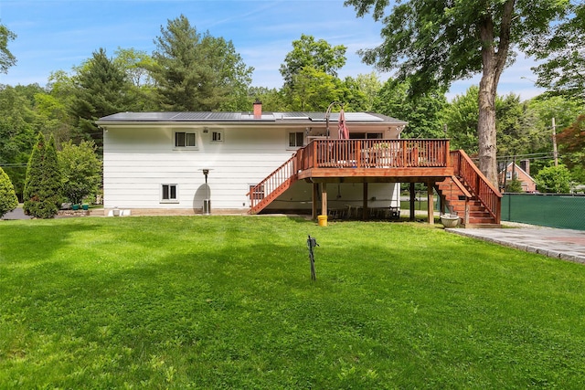 49 Sherwood Rd, Cortlandt Manor, NY 10567 - back of house featuring stairway, a wooden deck, a yard, and a chimney