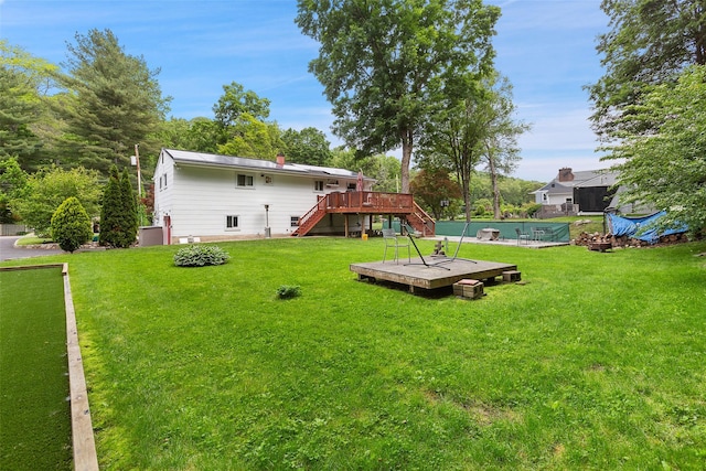 49 Sherwood Rd, Cortlandt Manor, NY 10567 - view of grassy yard featuring stairway, a deck, and a pool