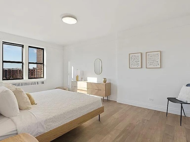 4035 Ithaca St Unit 6F, Elmhurst, NY 11373 - bedroom with wood finished floors and baseboards