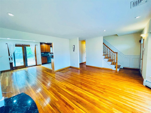24 Gaymor Ln, Commack, NY 11725 - unfurnished living room with light wood-type flooring, stairs, baseboards, and recessed lighting