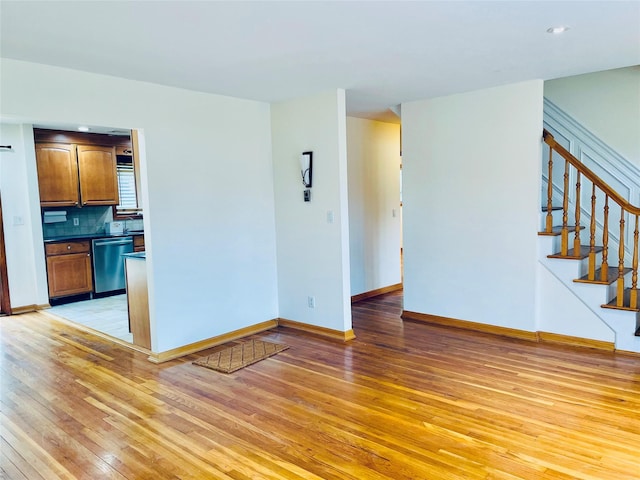 24 Gaymor Ln, Commack, NY 11725 - unfurnished living room featuring light wood finished floors, baseboards, stairway, and recessed lighting