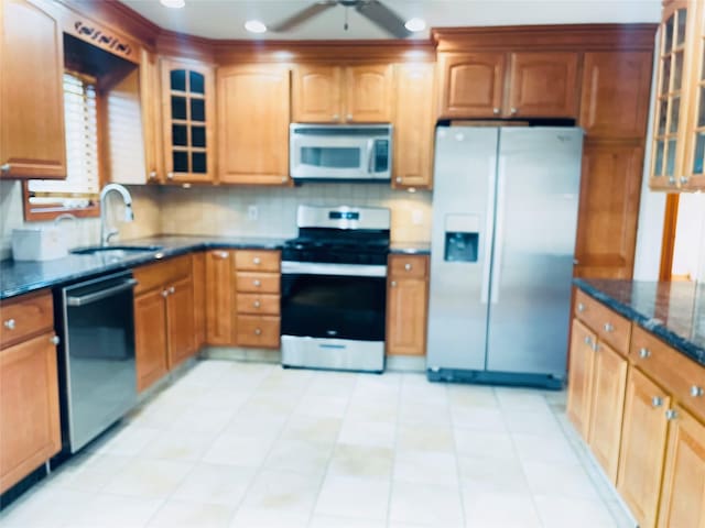24 Gaymor Ln, Commack, NY 11725 - kitchen with stainless steel appliances, a sink, glass insert cabinets, dark stone countertops, and tasteful backsplash