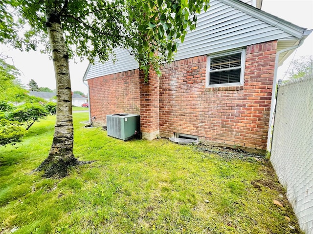 24 Gaymor Ln, Commack, NY 11725 - view of green lawn with central AC unit