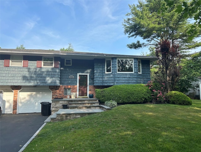 18 Butterfield Dr, Greenlawn, NY 11740 - bi-level home with a front lawn, an attached garage, and asphalt driveway