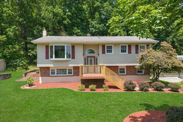 15 Mari Rd, Chester, NY 10918 - split foyer home featuring a chimney, a front lawn, and brick siding