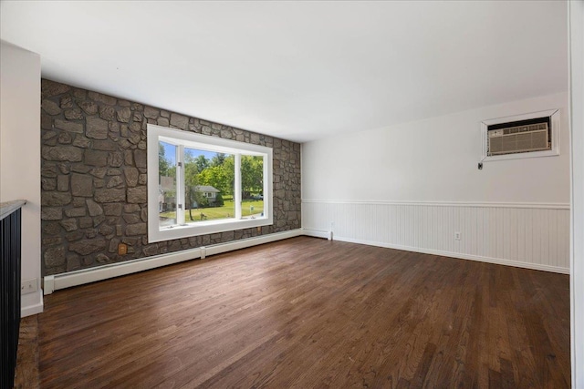 15 Mari Rd, Chester, NY 10918 - empty room featuring an AC wall unit, wood finished floors, baseboard heating, and a wainscoted wall
