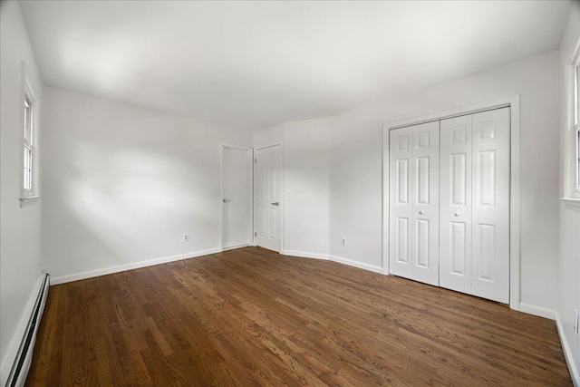 15 Mari Rd, Chester, NY 10918 - unfurnished bedroom with baseboard heating, dark wood-style flooring, and baseboards