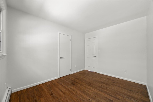 15 Mari Rd, Chester, NY 10918 - spare room with a baseboard radiator, dark wood-style floors, and baseboards