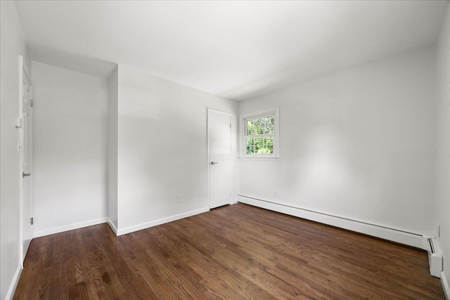 15 Mari Rd, Chester, NY 10918 - empty room featuring wood finished floors, a baseboard heating unit, and baseboards
