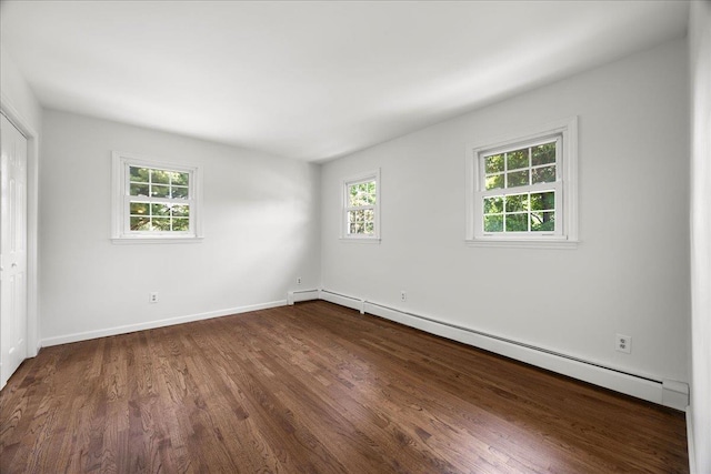 15 Mari Rd, Chester, NY 10918 - unfurnished room with a baseboard radiator, dark wood-style floors, and baseboards