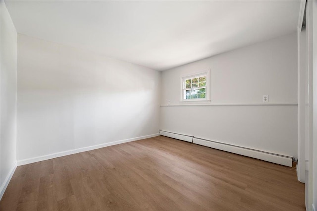 15 Mari Rd, Chester, NY 10918 - unfurnished room with a baseboard radiator, wood finished floors, and baseboards