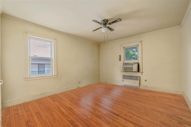 155 Carman Ave, East Rockaway, NY 11518 - spare room with radiator heating unit, ceiling fan, wood finished floors, ornamental molding, and baseboards