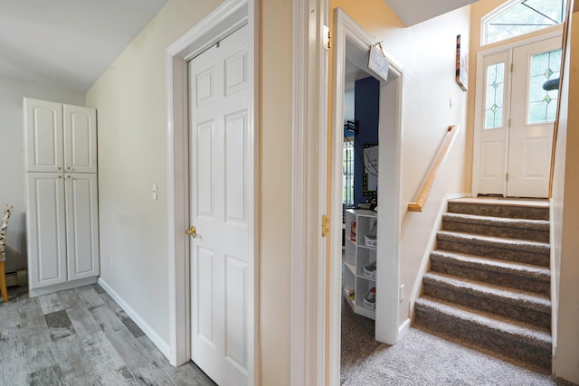 14 Arlington St, Patchogue, NY 11772 - entrance foyer featuring stairway, baseboards, and light wood finished floors