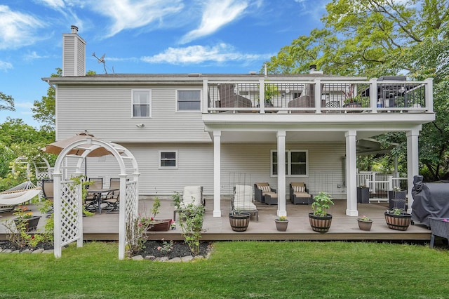 14 Arlington St, Patchogue, NY 11772 - back of house featuring a balcony, an outdoor hangout area, a lawn, and a chimney