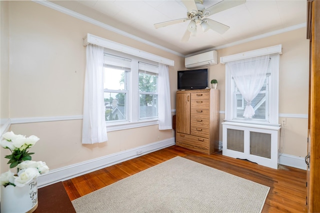 17 Denton Ave, East Rockaway, NY 11518 - bedroom featuring a wall mounted AC, wood finished floors, ornamental molding, baseboards, and ceiling fan