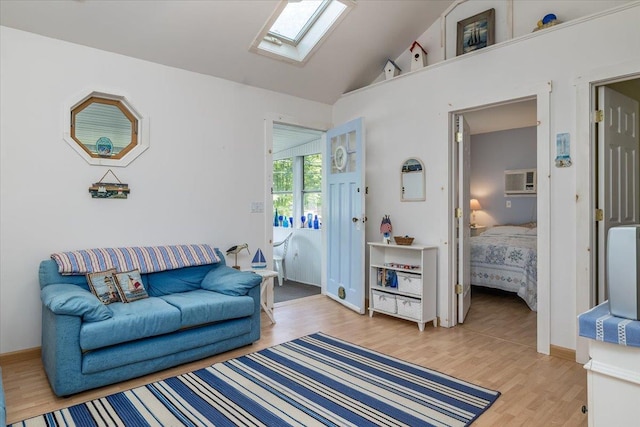 25 Cottage Rd, Baiting Hollow, NY 11933 - living room featuring a skylight, light wood-style floors, and high vaulted ceiling
