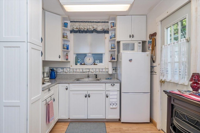 25 Cottage Rd, Baiting Hollow, NY 11933 - kitchen featuring freestanding refrigerator, open shelves, a sink, and white cabinetry