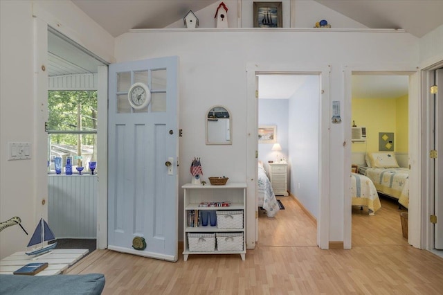 25 Cottage Rd, Baiting Hollow, NY 11933 - bedroom with wood finished floors, vaulted ceiling, baseboards, and an AC wall unit