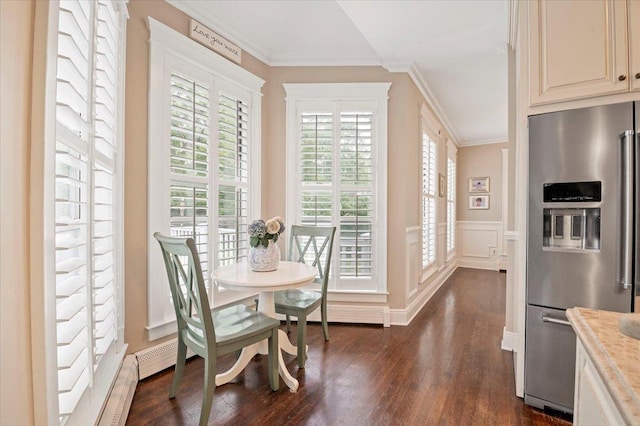 57 Harbor Park Dr, Centerport, NY 11721 - dining space with dark wood-style floors, crown molding, wainscoting, and a decorative wall