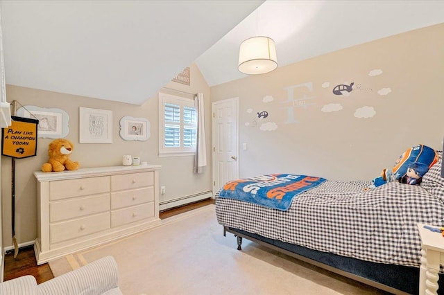 57 Harbor Park Dr, Centerport, NY 11721 - bedroom featuring a baseboard radiator, lofted ceiling, and wood finished floors