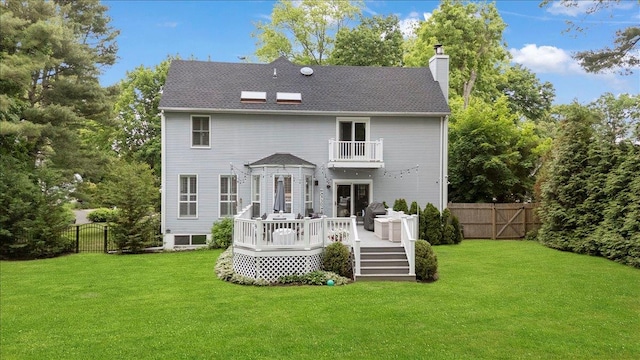 57 Harbor Park Dr, Centerport, NY 11721 - back of property with a balcony, a chimney, a gate, a wooden deck, and a shingled roof