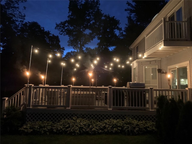 57 Harbor Park Dr, Centerport, NY 11721 - view of deck at night