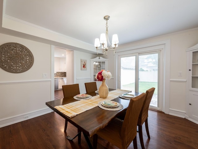62 Webster Ave, Manhasset, NY 11030 - dining space with a chandelier, dark wood-style floors, and ornamental molding