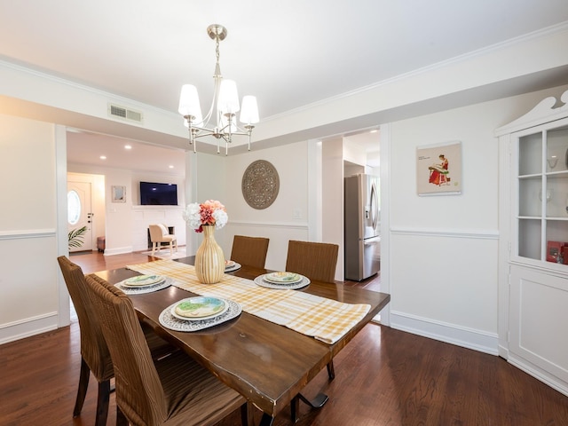 62 Webster Ave, Manhasset, NY 11030 - dining space with a chandelier, crown molding, and wood finished floors