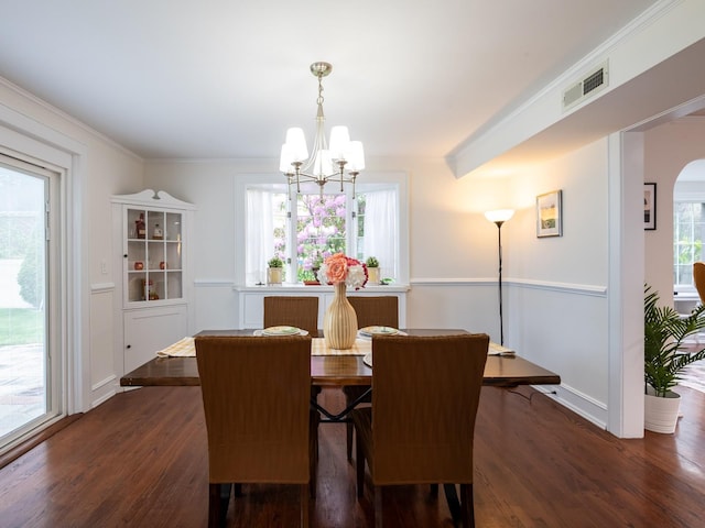 62 Webster Ave, Manhasset, NY 11030 - dining space featuring a chandelier, dark wood-style floors, and ornamental molding