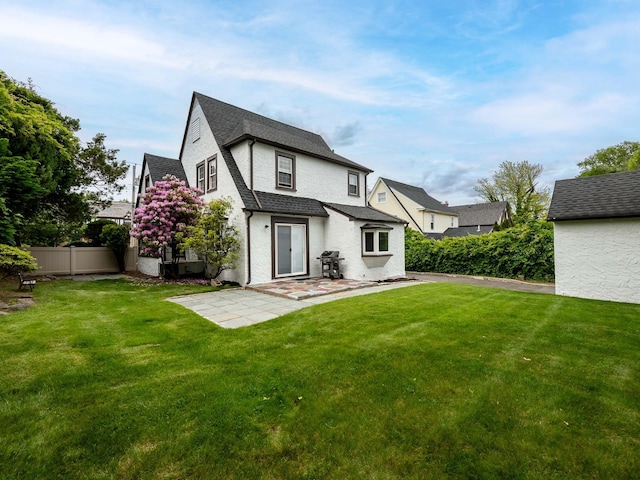 62 Webster Ave, Manhasset, NY 11030 - back of property with a patio, roof with shingles, and stucco siding