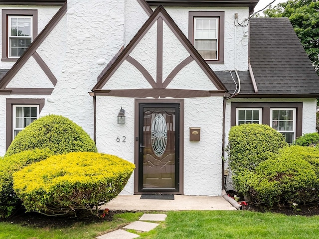 62 Webster Ave, Manhasset, NY 11030 - entrance to property with stucco siding and a shingled roof