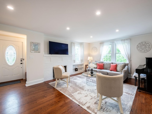 62 Webster Ave, Manhasset, NY 11030 - living area featuring ornamental molding, dark wood-style floors, a fireplace, and recessed lighting