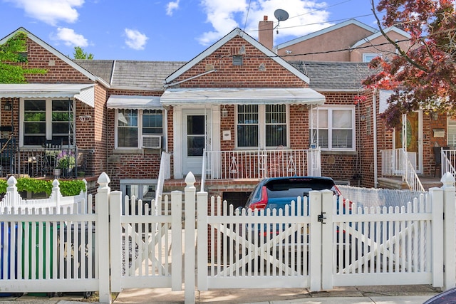 1304 Waring Ave, Bronx, NY 10469 - view of front of house with brick siding, a gate, a fenced front yard, covered porch, and cooling unit