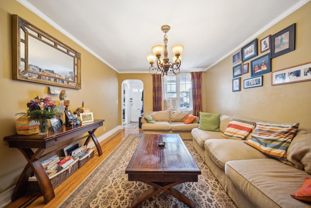 1304 Waring Ave, Bronx, NY 10469 - living room featuring arched walkways, ornamental molding, a chandelier, wood finished floors, and baseboards