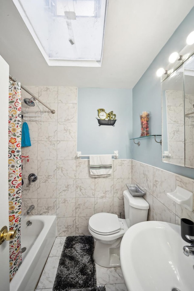 1304 Waring Ave, Bronx, NY 10469 - bathroom featuring marble finish flooring, a sink, toilet, shower / tub combo, and a wainscoted wall