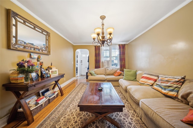 1304 Waring Ave, Bronx, NY 10469 - living area with arched walkways, ornamental molding, a chandelier, light wood-style flooring, and baseboards