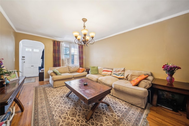 1304 Waring Ave, Bronx, NY 10469 - living area featuring arched walkways, ornamental molding, wood finished floors, and a chandelier
