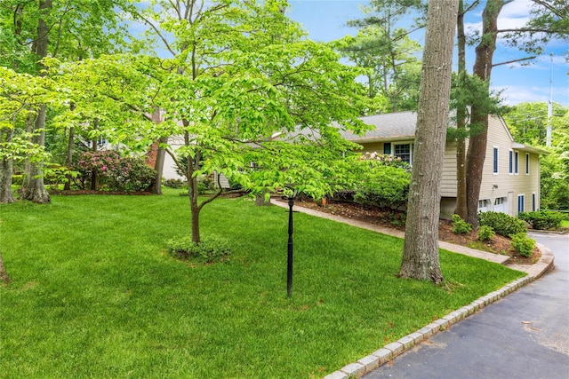 32 Lower Cross, Shoreham, NY 11786 - view of front of property featuring a garage, a front yard, and driveway