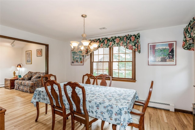 32 Lower Cross, Shoreham, NY 11786 - dining space with a baseboard radiator, a chandelier, light wood-type flooring, and baseboards