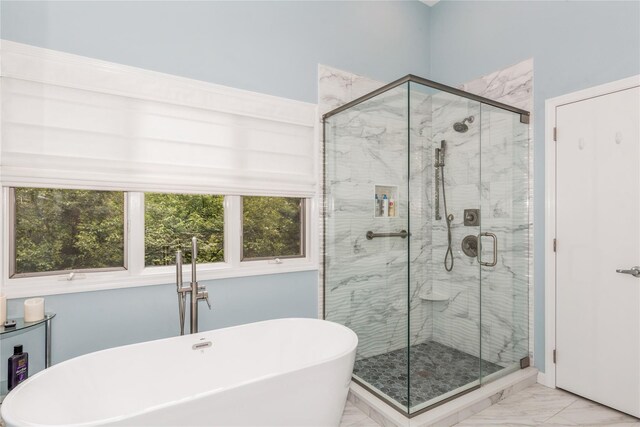 32 Lower Cross, Shoreham, NY 11786 - bathroom featuring marble look tile flooring, a soaking tub, and a stall shower