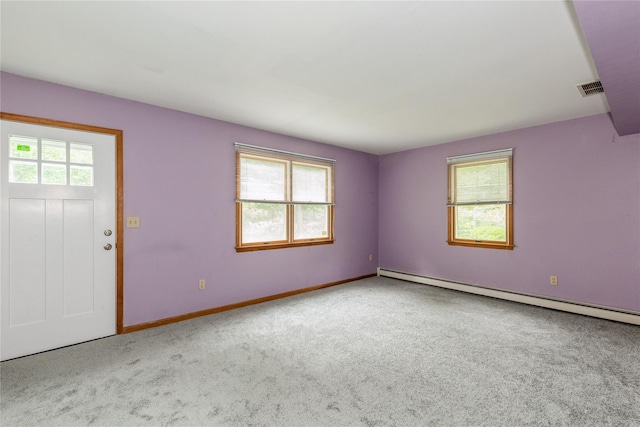 32 Lower Cross, Shoreham, NY 11786 - foyer with plenty of natural light, baseboard heating, carpet, and baseboards