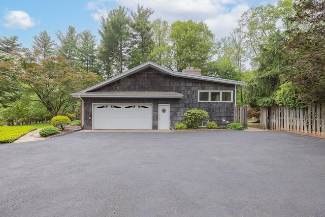 211 N Little Tor Rd, New City, NY 10956 - view of front facade featuring a chimney and driveway