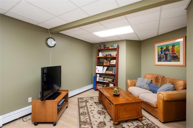 41 Mountain Brook Dr, Cold Spring, NY 10516 - living area featuring a paneled ceiling, baseboard heating, and baseboards