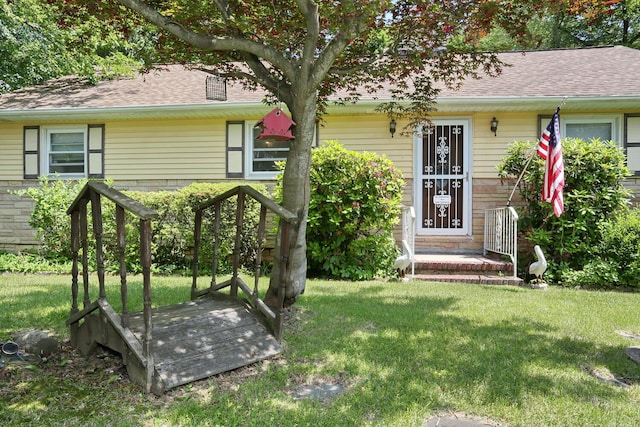 173 Massachusetts Ave, Congers, NY 10920 - rear view of property featuring a yard and roof with shingles