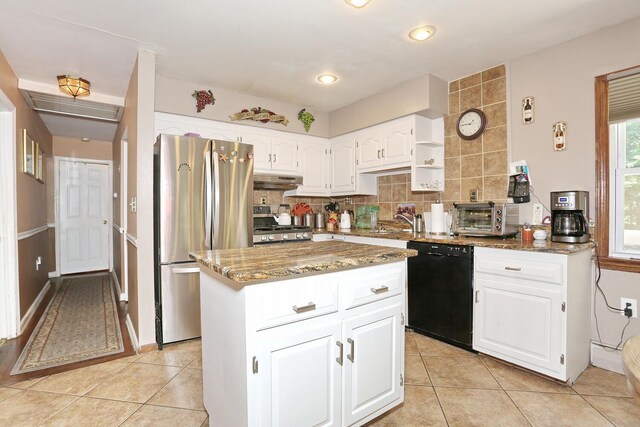 173 Massachusetts Ave, Congers, NY 10920 - kitchen featuring appliances with stainless steel finishes, under cabinet range hood, stone counters, and light tile patterned floors