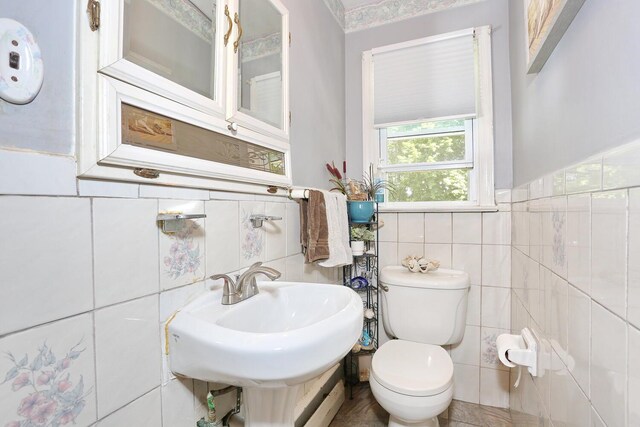 173 Massachusetts Ave, Congers, NY 10920 - bathroom featuring tile walls, toilet, and a wainscoted wall