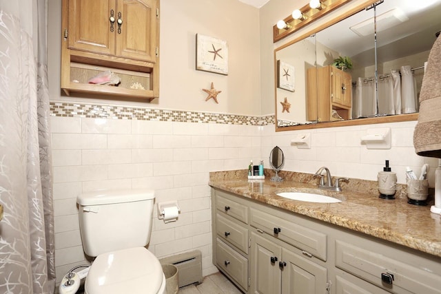 173 Massachusetts Ave, Congers, NY 10920 - full bath with tile walls, vanity, toilet, a shower with curtain, and wainscoting