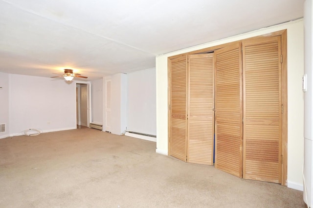 173 Massachusetts Ave, Congers, NY 10920 - unfurnished living room with light colored carpet, ceiling fan, and a baseboard radiator